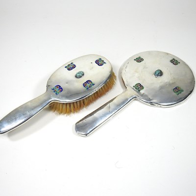 Lot 125 - An Edwardian silver hand mirror, 28cm long and...