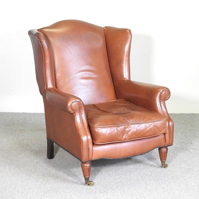 Lot 419 - A Laura Ashley brown leather upholstered wing...