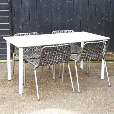 Lot 738 - A metal glass top garden table and four woven...