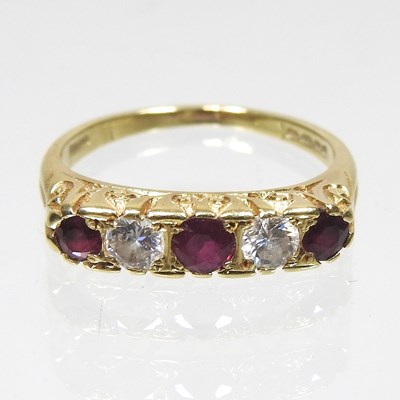 Lot 69 - An 18 carat gold ruby and diamond ring, set...