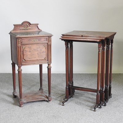 Lot 559 - A rosewood nest of three occasional tables,...