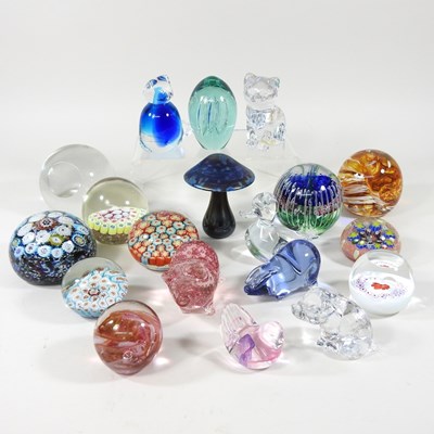 Lot 405 - A collection of various glass paperweights, to...