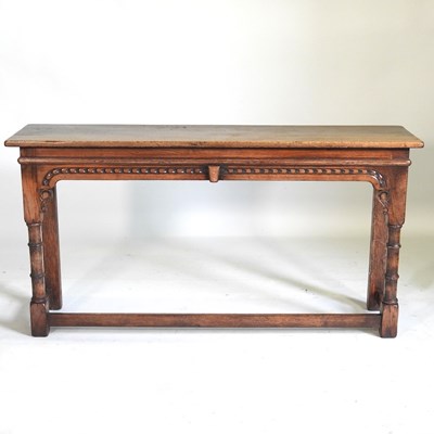 Lot 470 - A carved oak console table, 20th century, on...