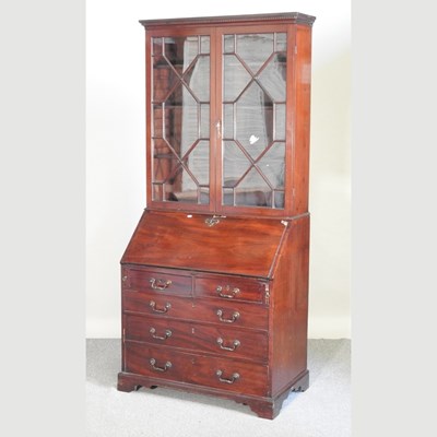 Lot 579 - A George III mahogany bureau bookcase