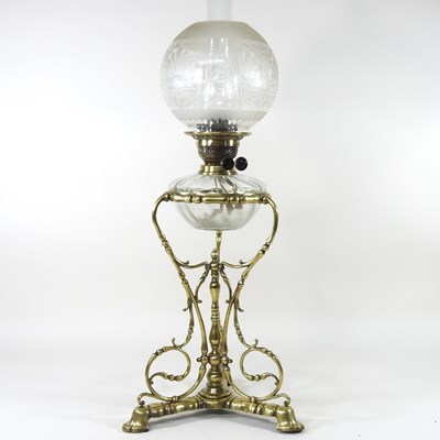 Lot 404 - An ornate 19th century brass oil lamp, with an...