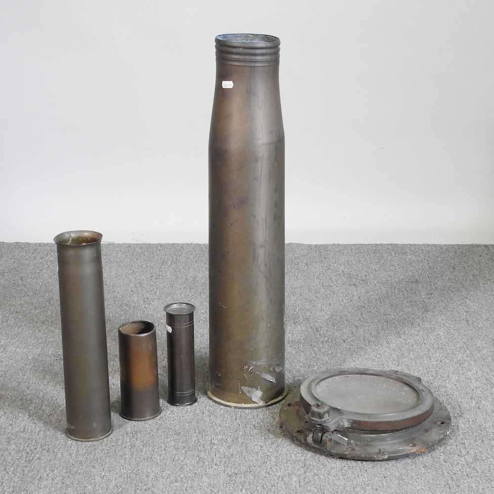 Lot 729 - A brass shell case, 71cm high, together with