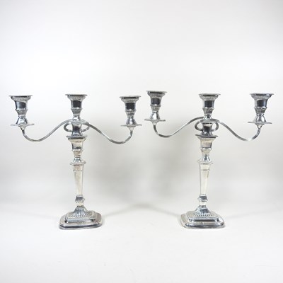 Lot 265 - A pair of silver plated twin branch table...