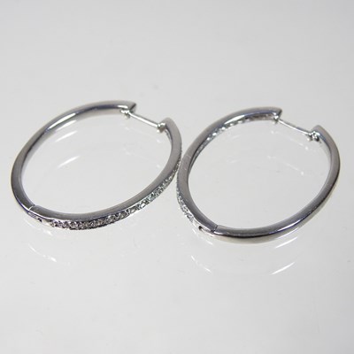 Lot 363 - A pair of 9 carat white gold and diamond set...