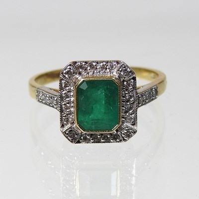 Lot 390 - An unmarked emerald and diamond cluster ring,...