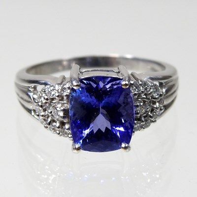 Lot 410 - An 18 carat white gold, diamond and tanzanite...