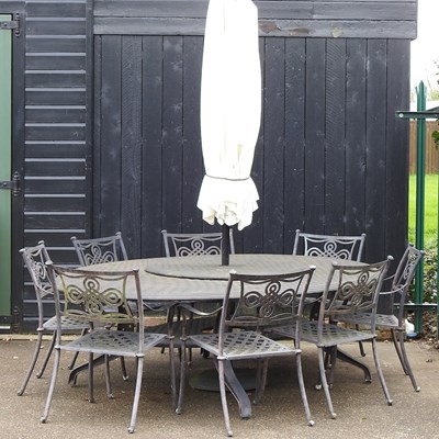 Lot 488 - A large cast metal oval garden table, together...