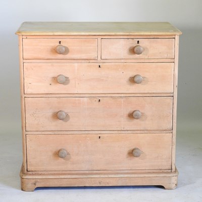 Lot 522 - A Victorian stripped pine chest of two short...