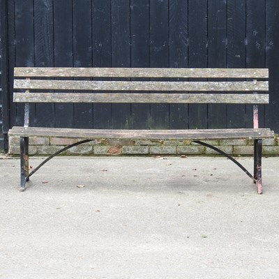 Lot 145 - A slatted garden bench, on painted iron supports