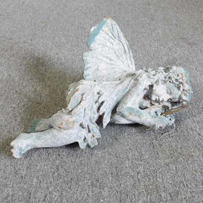 Lot 628 - A garden sculpture of a sleeping fairy, 40cm wide