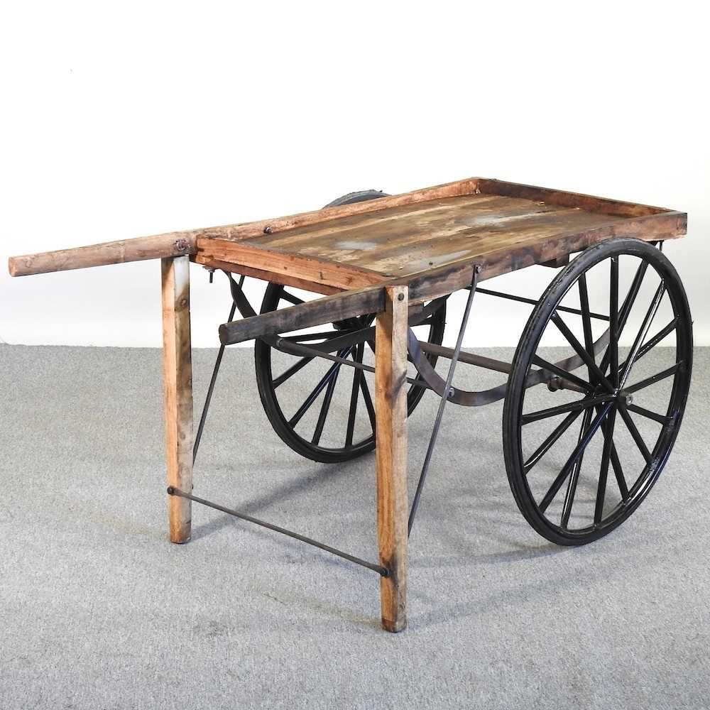 Lot 338 - A wooden hand cart, with spoked wheels