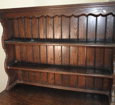 Lot 577 - An early 20th century carved oak dresser