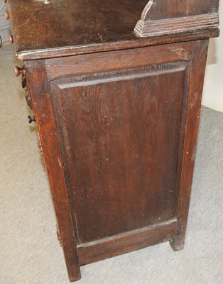 Lot 577 - An early 20th century carved oak dresser