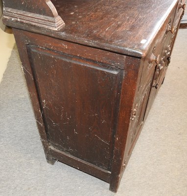 Lot 577 - An early 20th century carved oak dresser