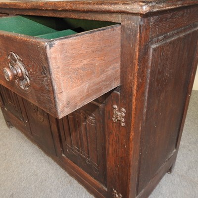 Lot 577 - An early 20th century carved oak dresser