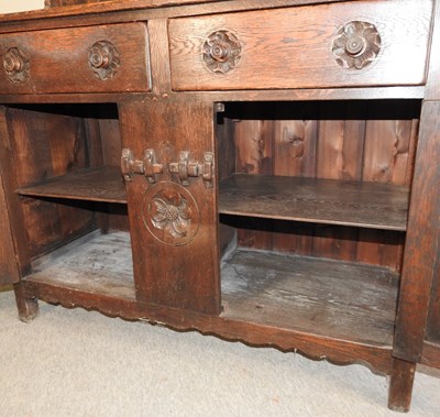 Lot 577 - An early 20th century carved oak dresser