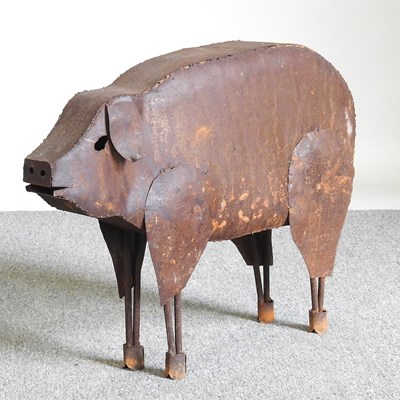 Lot 162 - A rusted metal garden sculpture of a pig, 63cm...