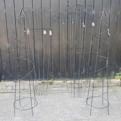 Lot 340 - A pair of black painted metal garden spires