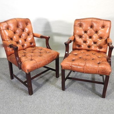 Lot 388 - A pair of leather upholstered button back open armchairs