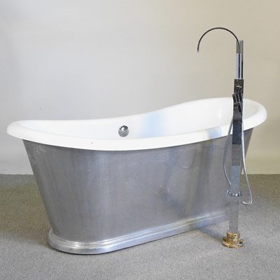Lot 10 - A free standing roll top bath, with a shower...