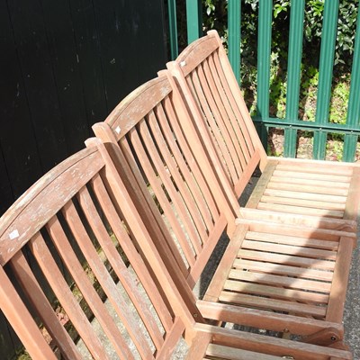 Lot 275 - A set of four teak folding garden chairs (4)