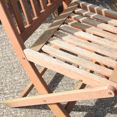 Lot 275 - A set of four teak folding garden chairs (4)