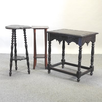 Lot 594 - A 19th century carved oak side table