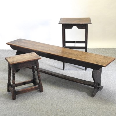 Lot 590 - An early 20th century oak bench