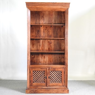 Lot 163 - An Eastern hardwood standing open bookcase,...