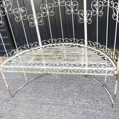 Lot 632 - A white painted metal garden arbour bench