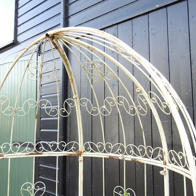 Lot 632 - A white painted metal garden arbour bench