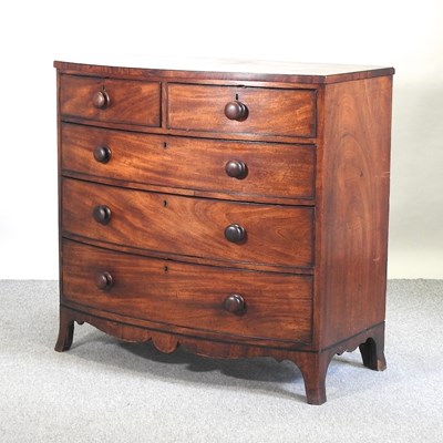 Lot 642 - A 19th century mahogany bow front chest