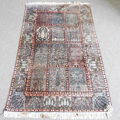 Lot 255 - A small Persian part silk rug, with foliate...