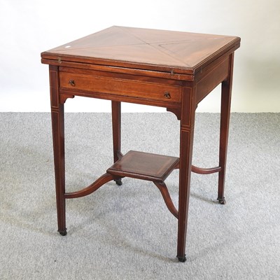Lot 549 - An Edwardian mahogany and inlaid envelope card table