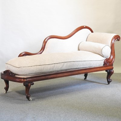 Lot 653 - A 19th century mahogany chaise longue