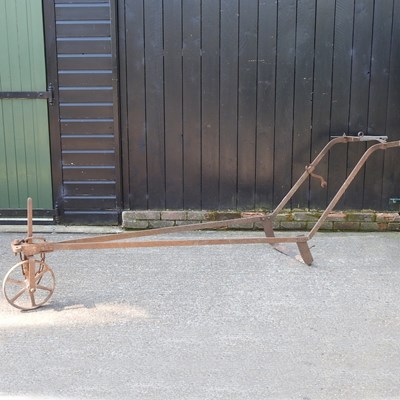 Lot 339 - A 19th century iron hand plough, 300cm long