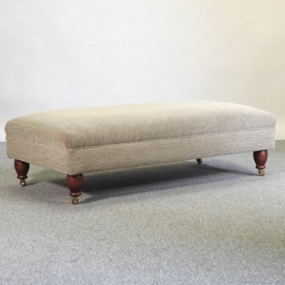 Lot 656 - A Wesley Barrell beige upholstered footstool