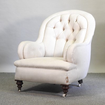 Lot 658 - A Victorian cream upholstered button back armchair