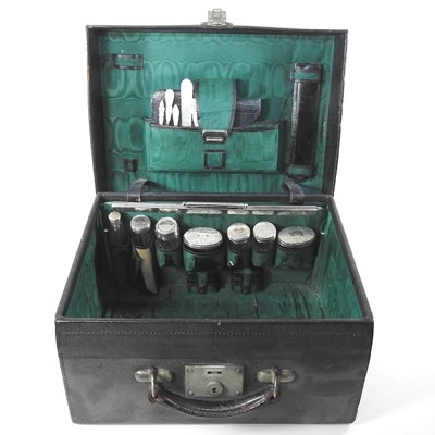 Lot 62 - A Victorian black leather travelling vanity...