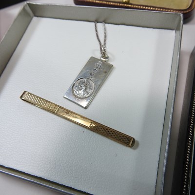 Lot 176 - A 9 carat gold tie pin, with engine turned...