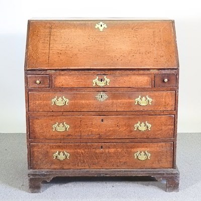 Lot 590 - An 18th century oak bureau, with a fitted...