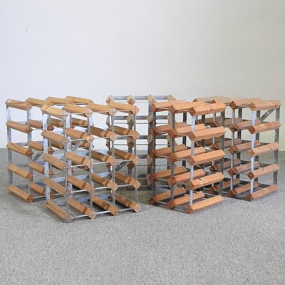 Lot 100 - Five various wooden and metal wine racks (5)