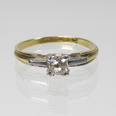 Lot 41 - An 18 carat gold and platinum set single stone...