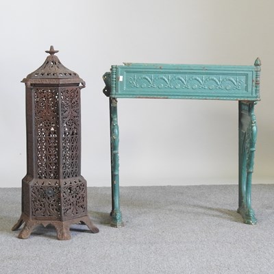 Lot 141 - A cast iron heater, 85cm high, together with a...