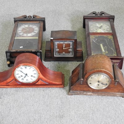 Lot 295 - A 1930's mantel clock, together with four...