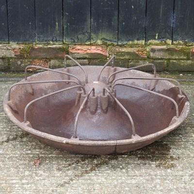 Lot 256 - A cast iron circular pig trough, 84cm diameter